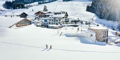 Wellnessurlaub - Entfernung zum Strand - Für den Skiurlaub mit direktem Einstieg in das Skigebiet Hochkönig im Salzburger Land ist das 4*S-Hotel Übergossene Alm Resort die perfekte Adresse. - Übergossene Alm Resort