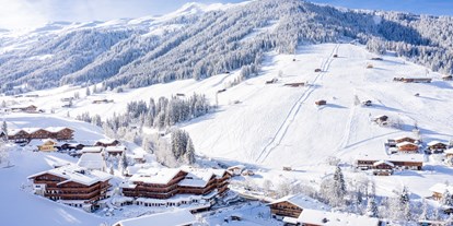 Wellnessurlaub - Verpflegung: alkoholfreie Getränke ganztags inklusive - Österreich - Winteransicht mit Einstieg ins Skigebiet - Galtenberg Resort 4*S