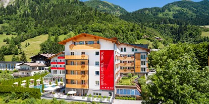 Wellnessurlaub - Pantai Luar Massage - Österreich - Aussenansicht Sommer - Impuls Hotel Tirol
