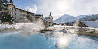 Wellnessurlaub - Hotel-Schwerpunkt: Wellness & Romantik - Österreich - Außenpool Winter - Posthotel Achenkirch