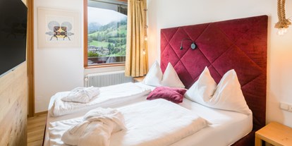 Wellnessurlaub - Ganzkörpermassage - Klagenfurt - Schlafzimmer Suite Talblick - Hotel NockResort