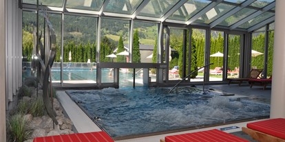 Wellnessurlaub - Gesichtsmassage - Bad Hofgastein - Pool - Impuls Hotel Tirol