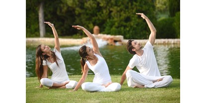 Wellnessurlaub - Hotel-Schwerpunkt: Wellness & Fitness - Portugal - Yoga im Garten - Vila Vita Parc Resort & Spa