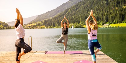 Wellnessurlaub - Hotel-Schwerpunkt: Wellness & Familie - Nockberge - Yoga am See - Fitnessprogramm - Familien - Sportresort Brennseehof 